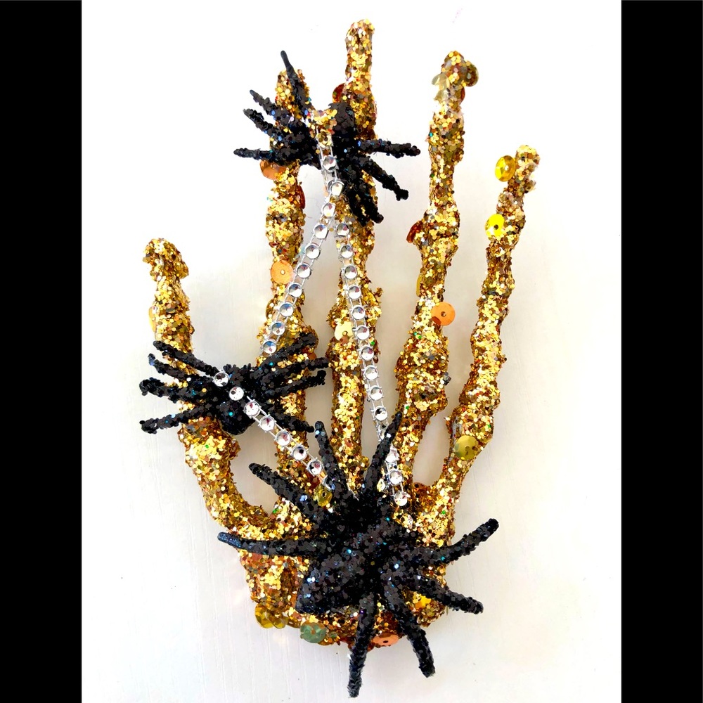 Artisan 1 of layers of Encrusted gold tones cover skeletal hand & web of spiders